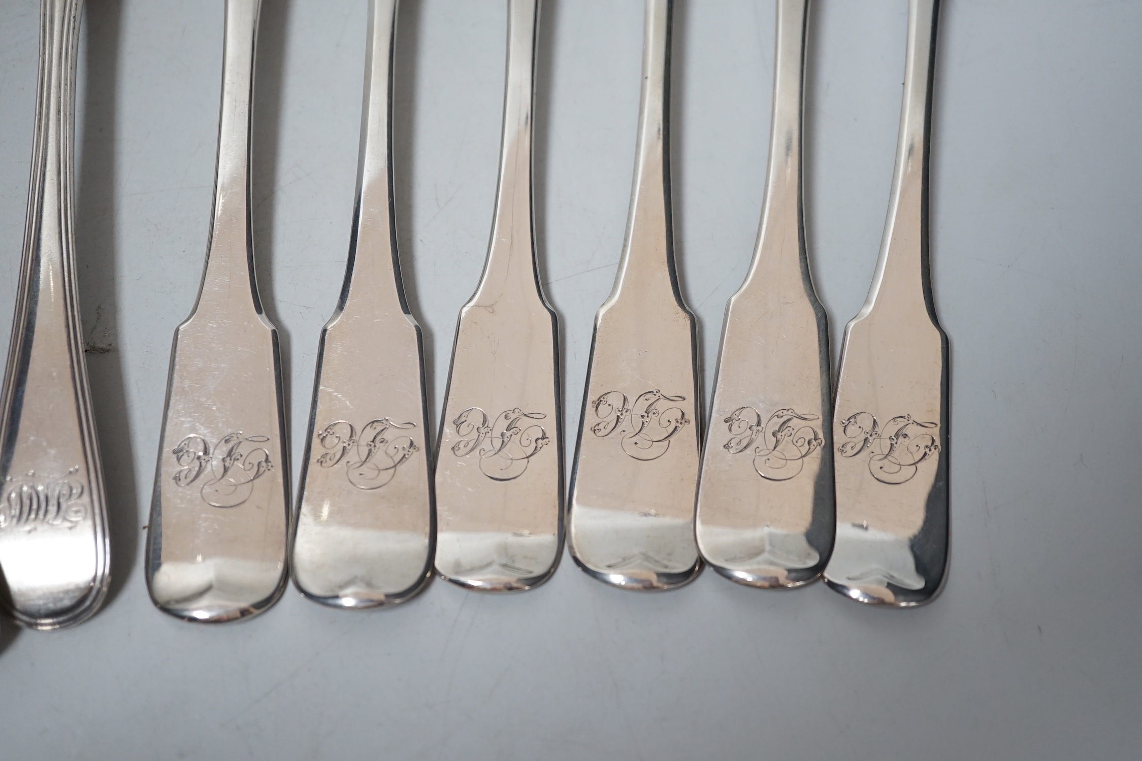 A harlequin set of six Georgian Scottish silver fiddle pattern table forks and a similar harlequin set of six Old English fiddle pattern table spoons, 24.1oz.